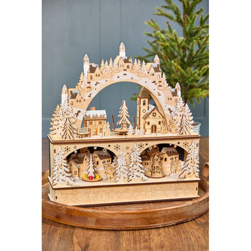 14.75 Lighted Laser Cut Wood Village Scene with Moving Figurine and Candles